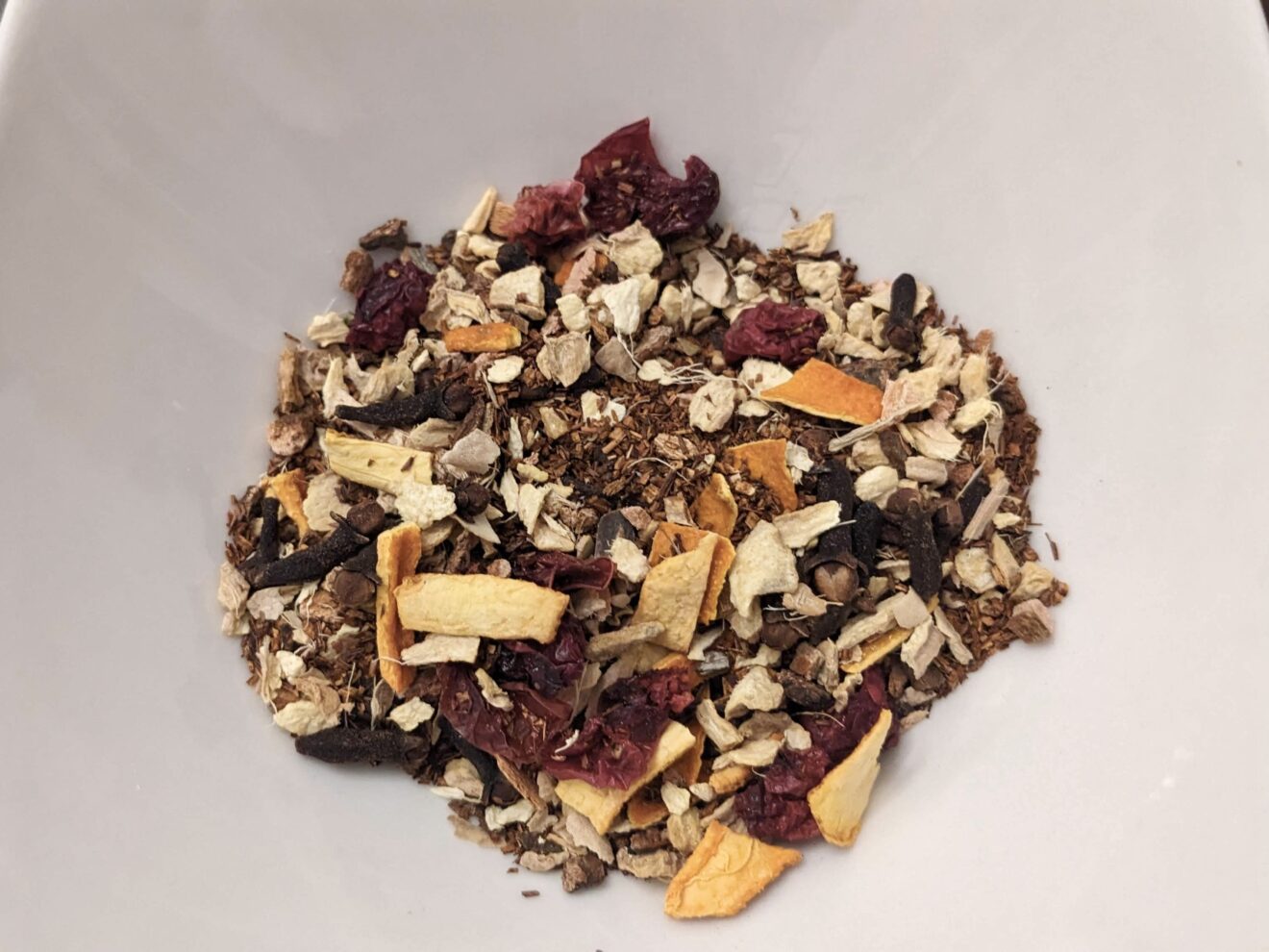 winter's end specialty herbal tea blend with rooibos, orange peels, cranberries, wild cherry bark, and ginger.