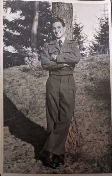 man standing by tree