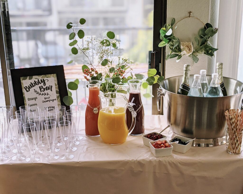 front view of drink station with fresh juices and empty glasses