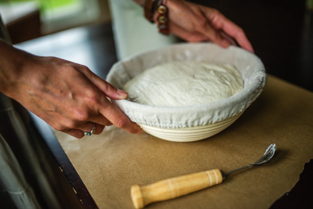 sourdough bread dough sitting in a banneton basket