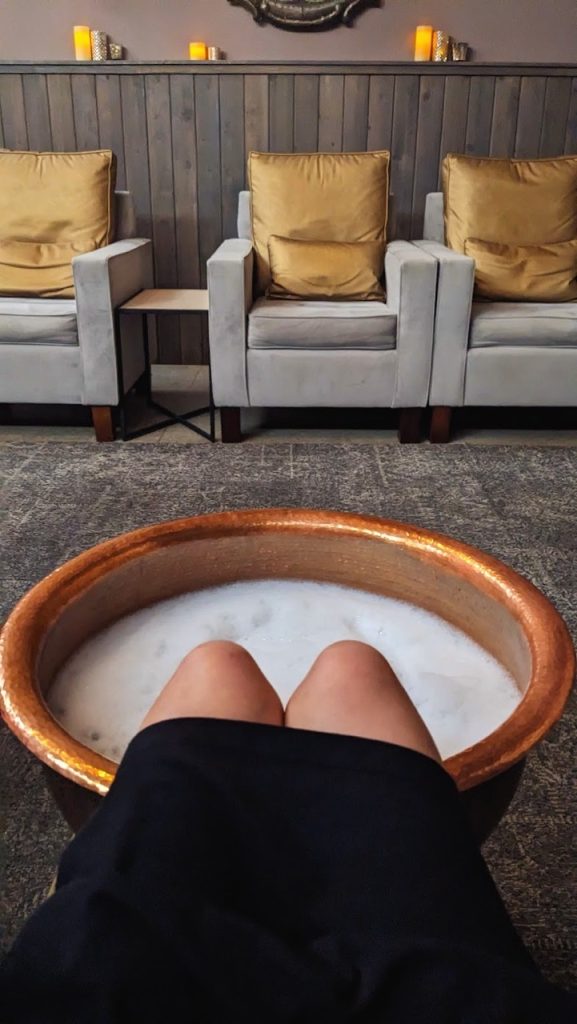 woman's legs in a foot spa