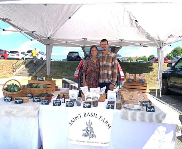 couple standing in front of a booth