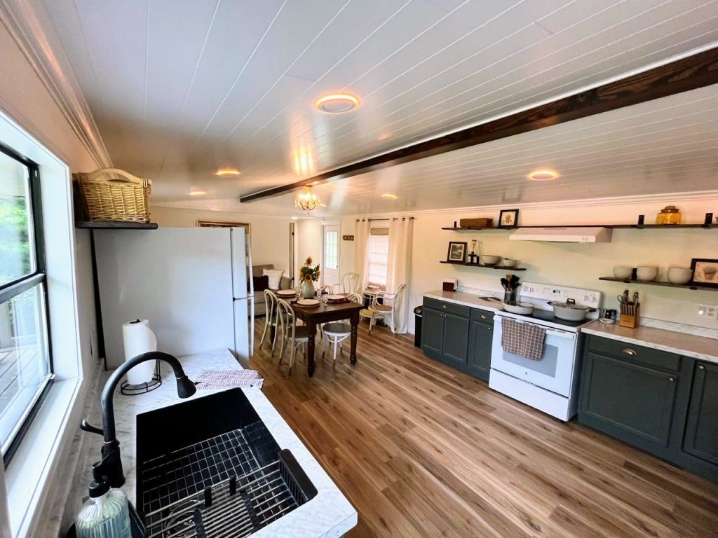 wide angle view of kitchen and recessed night lighting