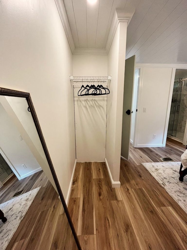 closet and mirror in a master bedroom